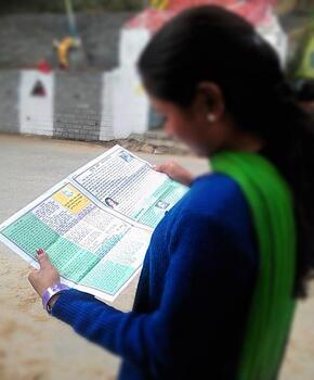 A Teen reading Tubari magazine.jpg - 290x350